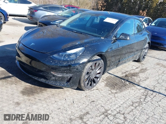 2021 Tesla Model 3 Performance with VIN 5YJ3E1EC5MF090518, listed as a IAAI auction lot 38775658 with 14,118 mi miles and . Bid and sale history available at carsss.com. Image 2.