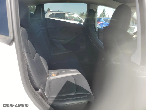 2023 Tesla Model Y Long Range with VIN 7SAYGDEE3PF751019, listed as a Copart auction lot 52716005 with 24,591 mi miles and Salvage Title. Bid and sale history available at carsss.com. Image 10.