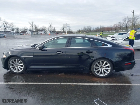 2011 Jaguar XJ with VIN SAJWA1CB8BLV12389, listed as a IAAI auction lot 41957217 with 51,585 mi miles. Bid and sale history available at carsss.com. Image 14.