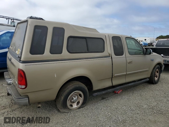 2000 Ford F-150 XL with VIN 1FTRX17L3YKB07018, listed as a Copart auction lot 66998714 with 0 mi miles and Salvage Title. Bid and sale history available at carsss.com. Image 3.