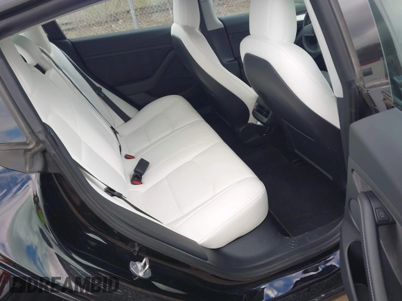 2021 Tesla Model 3 Long Range with VIN 5YJ3E1EB7MF052988, listed as a IAAI auction lot 42052662 with 29,877 mi miles and . Bid and sale history available at carsss.com. Image 8.