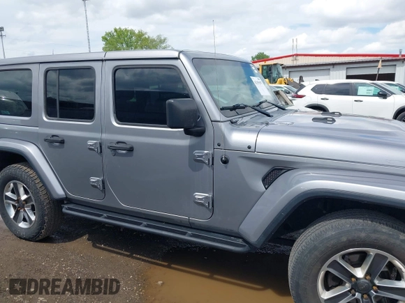2019 Jeep Wrangler Unlimited Sahara with VIN 1C4HJXEN5KW542403, listed as a IAAI auction lot 42159197 with 60,378 mi miles and . Bid and sale history available at DreamBid. Image 13.