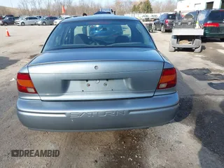 2002 Saturn SL z VIN 1G8ZH52892Z151119, wystawiony jako IAAI lot #41764757 z przebiegiem 82 017 mil mil oraz . Historia ofert i sprzedaży dostępna na DreamBid. Obrazek 16.