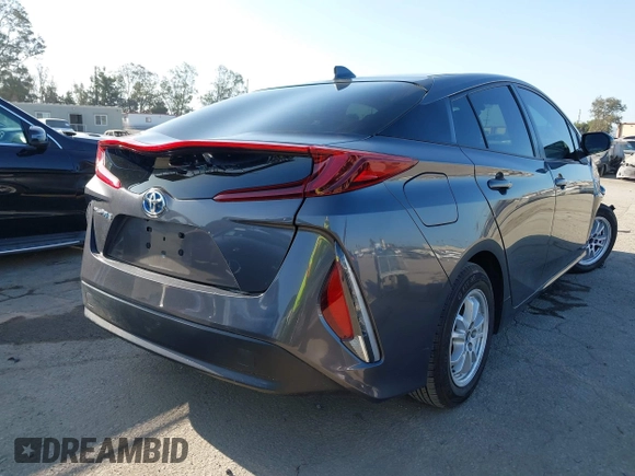 2021 Toyota Prius LE with VIN JTDKAMFP1M3195662, listed as a IAAI auction lot 42799476 with 47,560 mi miles and . Bid and sale history available at DreamBid. Image 4.