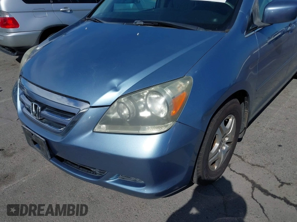 2006 Honda Odyssey EX-L z VIN 5FNRL38706B075356, wystawiony jako IAAI lot #42021960 z przebiegiem 120 455 mil mil oraz . Historia ofert i sprzedaży dostępna na DreamBid. Obrazek 17.