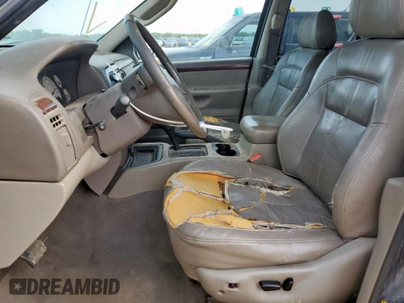 2004 Jeep Grand Cherokee with VIN 1J8GX58J54C121513, listed as a Copart auction lot 59384005 with 221,397 mi miles and Salvage title. Bid and sale history available at DreamBid. Image 7.