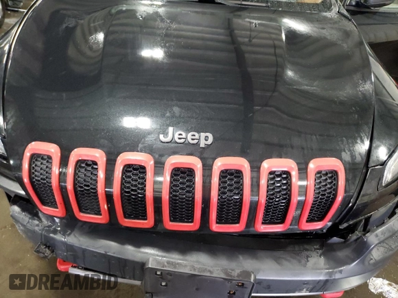 2014 Jeep Cherokee Trailhawk with VIN 1C4PJMBSXEW187981, listed as a Copart auction lot 56711885 with 157,317 mi miles and Salvage title. Bid and sale history available at DreamBid. Image 12.