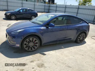 2022 Tesla Model Y Performance z VIN 7SAYGDEF4NF489629, wystawiony jako Copart lot #64181775 z przebiegiem 22 120 mil mil oraz Szkoda całkowita • Salvage title. Historia ofert i sprzedaży dostępna na DreamBid. Obrazek 1.
