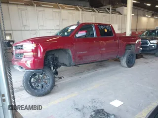 2018 Chevrolet Silverado 1500 LT with VIN 3GCUKREC0JG580317, listed as a IAAI auction lot 41868522 with 75,738 mi miles. Bid and sale history available at carsss.com. Image 2.