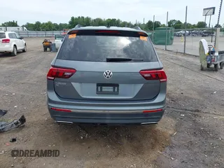 2021 Volkswagen Tiguan SE z VIN 3VV3B7AX8MM159316, wystawiony jako IAAI lot #42525546 z przebiegiem 70 141 mil mil oraz . Historia ofert i sprzedaży dostępna na DreamBid. Obrazek 16.