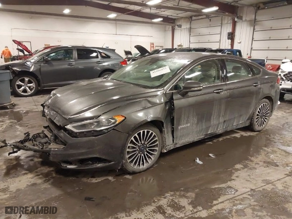 2018 Ford Fusion Hybrid Titanium with VIN 3FA6P0RU4JR147831, listed as a IAAI auction lot 41586033 with 101,088 mi miles. Bid and sale history available at carsss.com. Image 2.
