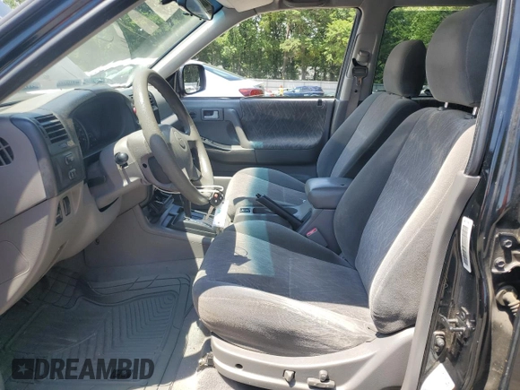 2003 Isuzu Rodeo z VIN 4S2CK58W734311374, wystawiony jako Copart lot #57949325 z przebiegiem 247 580 mil mil oraz Tytuł czysty. Historia ofert i sprzedaży dostępna na DreamBid. Obrazek 7.