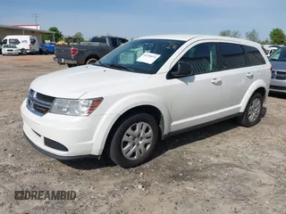 2015 Dodge Journey American Value Pkg with VIN 3C4PDCAB8FT605870, listed as a IAAI auction lot 41930474 with 205,741 mi miles. Bid and sale history available at carsss.com. Image 2.