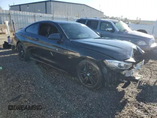 2014 BMW 4 Series 435i with VIN WBA3R1C56EK191111, listed as a Copart auction lot 76946514 with 107,094 mi miles and Salvage Title. Bid and sale history available at carsss.com. Image 4.