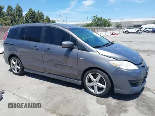 2009 Mazda 5 Touring z VIN JM1CR29L090350849, wystawiony jako IAAI lot #42366099 z przebiegiem 175 393 mil mil oraz . Historia ofert i sprzedaży dostępna na DreamBid. Obrazek 1.
