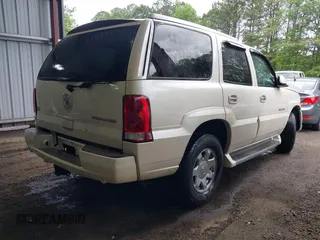 2003 Cadillac Escalade z VIN 1GYEK63NX3R241388, wystawiony jako IAAI lot #42227896 z przebiegiem 154 415 mil mil oraz . Historia ofert i sprzedaży dostępna na DreamBid. Obrazek 4.