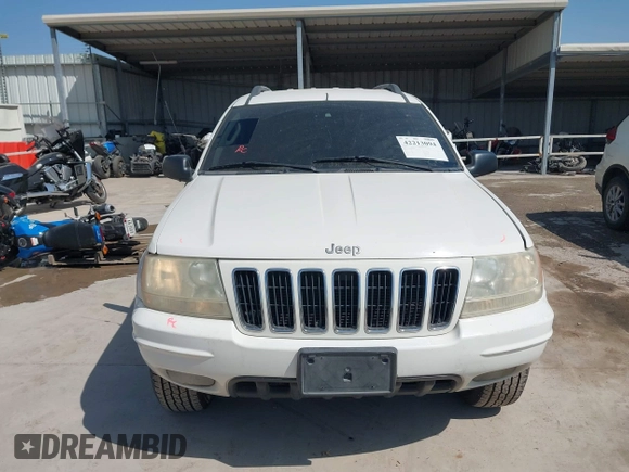 2003 Jeep Grand Cherokee Laredo with VIN 1J4GX48S43C518584, listed as a IAAI auction lot 42213094 with 163,743 mi miles and . Bid and sale history available at DreamBid. Image 13.