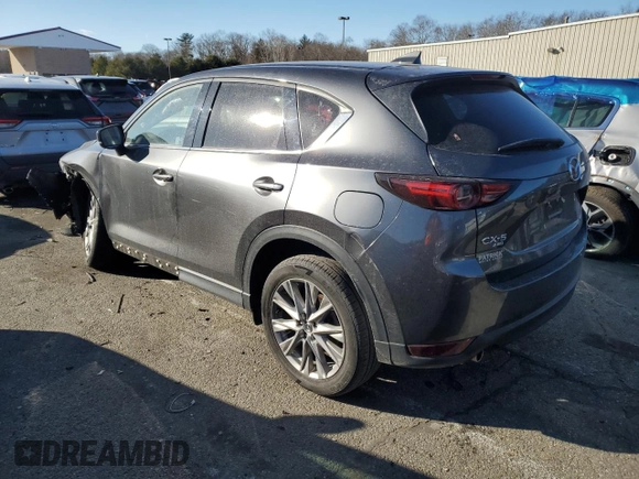2021 Mazda CX-5 Grand Touring with VIN JM3KFBDM9M0490239, listed as a Copart auction lot 43306975 with 47,010 mi miles and Salvage Title. Bid and sale history available at carsss.com. Image 2.