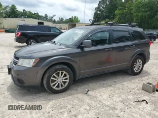 2017 Dodge Journey SXT z VIN 3C4PDCBG9HT537107, wystawiony jako Copart lot #58710675 z przebiegiem 261 861 mil mil oraz Czysty tytuł • Clean title. Historia ofert i sprzedaży dostępna na DreamBid. Obrazek 1.