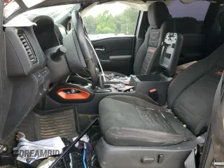 2023 Nissan Frontier Pro-4X with VIN 1N6ED1EK0PN617872, listed as a Copart auction lot 57125435 with 97,981 mi miles and Salvage title. Bid and sale history available at DreamBid. Image 7.