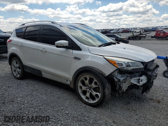 2015 Ford Escape Titanium z VIN 1FMCU9J90FUC41606, wystawiony jako Copart lot #57458455 z przebiegiem 71 671 mil mil oraz Szkoda całkowita • Salvage title. Historia ofert i sprzedaży dostępna na DreamBid. Obrazek 4.