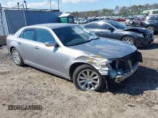 2013 Chrysler 300 with VIN 2C3CCAET2DH650094, listed as a IAAI auction lot 41860272 with 125,568 mi miles. Bid and sale history available at carsss.com. Image 1.