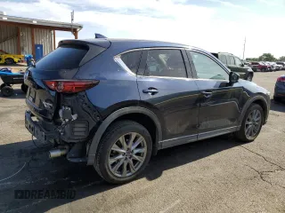 2021 Mazda CX-5 Grand Touring with VIN JM3KFBDM3M1344784, listed as a Copart auction lot 58051445 with 69,593 mi miles and Salvage title. Bid and sale history available at DreamBid. Image 3.