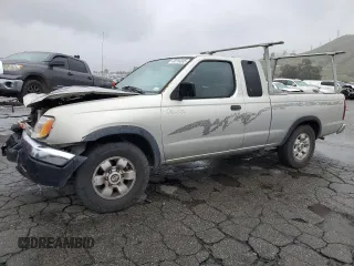 1999 Nissan Frontier XE with VIN 1N6DD26S4XC327016, listed as a Copart auction lot 49310335 with 159,728 mi miles and Clean title. Bid and sale history available at DreamBid. Image 1.
