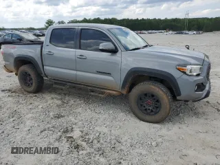 2021 Toyota Tacoma SR with VIN 3TMCZ5AN2MM397322, listed as a Copart auction lot 55470385 with 66,224 mi miles and Salvage title. Bid and sale history available at DreamBid. Image 4.