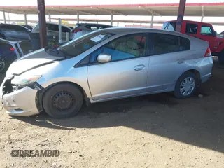 2010 Honda Insight LX z VIN JHMZE2H53AS007016, wystawiony jako IAAI lot #42096274 z przebiegiem 173 519 mil mil oraz . Historia ofert i sprzedaży dostępna na DreamBid. Obrazek 17.