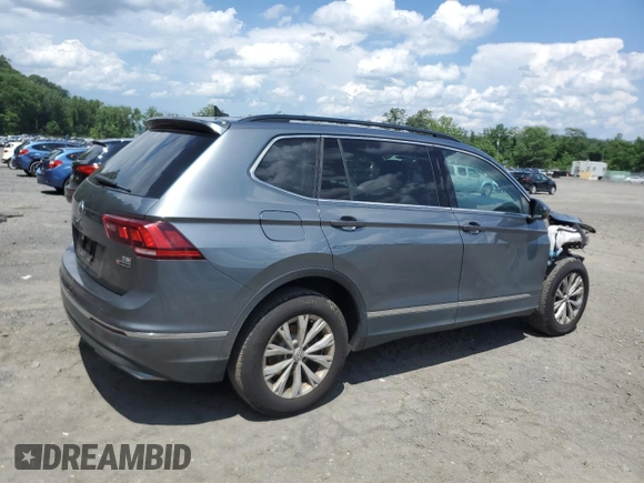 2018 Volkswagen Tiguan SEL with VIN 3VV2B7AXXJM060858, listed as a Copart auction lot 60639885 with 119,148 mi miles and Salvage title. Bid and sale history available at DreamBid. Image 3.