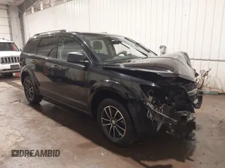 2017 Dodge Journey SE z VIN 3C4PDCAB4HT695490, wystawiony jako IAAI lot #41301719 z przebiegiem 103 642 mil mil oraz . Historia ofert i sprzedaży dostępna na DreamBid. Obrazek 1.