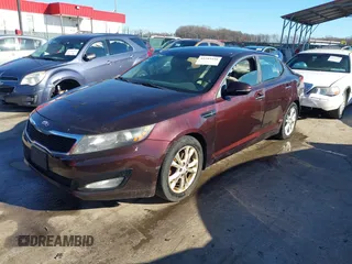 2013 Kia Optima LX z VIN 5XXGM4A71DG186111, wystawiony jako IAAI lot #41189410 z przebiegiem 214 084 mil mil oraz . Historia ofert i sprzedaży dostępna na DreamBid. Obrazek 2.