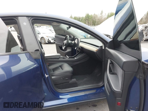 2021 Tesla Model Y Long Range with VIN 5YJYGDEE9MF071120, listed as a IAAI auction lot 40870088 with 73,438 mi miles and . Bid and sale history available at carsss.com. Image 5.