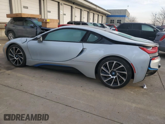 2015 BMW i8 z VIN WBY2Z2C56FV674231, wystawiony jako Copart lot #37218014 z przebiegiem 27 465 mil mil oraz . Historia ofert i sprzedaży dostępna na DreamBid. Obrazek 2.