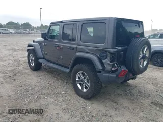 2018 Jeep Wrangler Unlimited Sahara with VIN 1C4HJXEN8JW303023, listed as a IAAI auction lot 42138631 with 72,463 mi miles and . Bid and sale history available at DreamBid. Image 3.