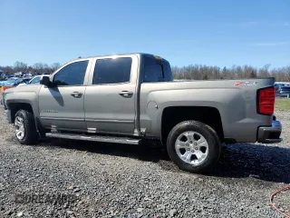 2017 Chevrolet Silverado 1500 LT with VIN 3GCUKREC0HG335785, listed as a Copart auction lot 51456305 with 104,614 mi miles and Salvage Title. Bid and sale history available at DreamBid. Image 2.