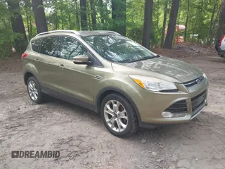 2014 Ford Escape Titanium with VIN 1FMCU9JX9EUB23972, listed as a IAAI auction lot 42217298 with 164,556 mi miles and . Bid and sale history available at DreamBid. Image 1.