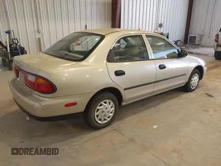 1997 Mazda Protege DX z VIN JM1BC1415V0133823, wystawiony jako IAAI lot #42091960 z przebiegiem 149 959 mil mil oraz . Historia ofert i sprzedaży dostępna na DreamBid. Obrazek 4.