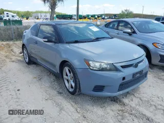 2012 Scion tC with VIN JTKJF5C79C3043661, listed as a IAAI auction lot 42020903 with 184,891 mi miles. Bid and sale history available at carsss.com. Image 1.