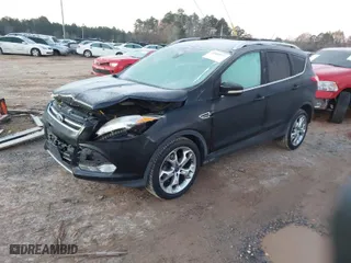 2014 Ford Escape Titanium with VIN 1FMCU9J95EUA96397, listed as a IAAI auction lot 41089757 with 107,494 mi miles. Bid and sale history available at carsss.com. Image 2.