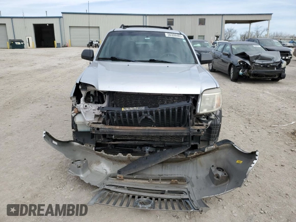2011 Mercury Mariner z VIN 4M2CN8B73BKJ06886, wystawiony jako Copart lot #50308485 z przebiegiem 118 584 mil mil oraz Szkoda całkowita • Salvage title. Historia ofert i sprzedaży dostępna na DreamBid. Obrazek 5.