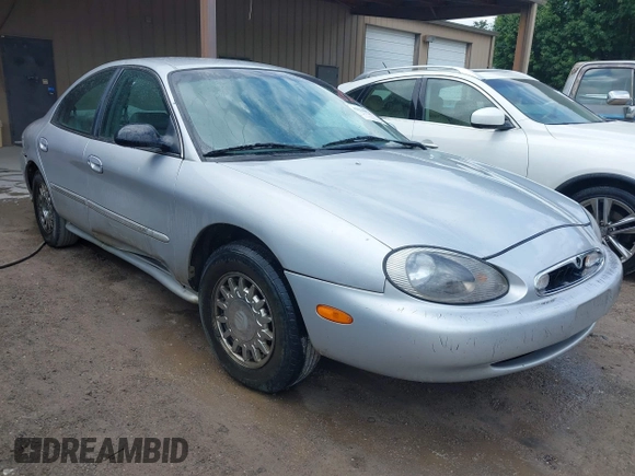 1997 Mercury Sable LS z VIN 1MELM53S5VA661602, wystawiony jako IAAI lot #42210072 z przebiegiem 106 344 mil mil oraz . Historia ofert i sprzedaży dostępna na DreamBid. Obrazek 1.