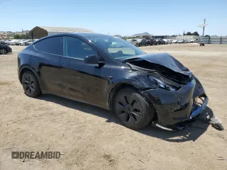2024 Tesla Model Y Long Range with VIN 7SAYGAEE9RF125458, listed as a Copart auction lot 59567365 with 28,966 mi miles and Salvage title. Bid and sale history available at DreamBid. Image 4.