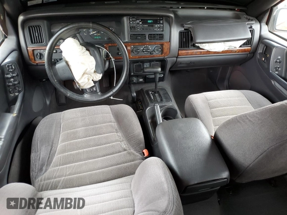 1997 Jeep Grand Cherokee Laredo with VIN 1J4GZ58S3VC739922, listed as a Copart auction lot 55667885 with 209,075 mi miles and Salvage title. Bid and sale history available at DreamBid. Image 8.