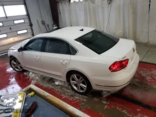 2015 Volkswagen Passat 1.8T Sport with VIN 1VWBT7A31FC050086, listed as a Copart auction lot 88990155 with 140,338 mi miles and Salvage Title. Bid and sale history available at carsss.com. Image 2.