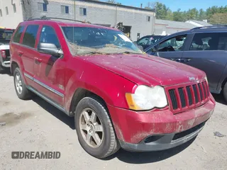 2009 Jeep Grand Cherokee Laredo with VIN 1J8GR48K79C543304, listed as a IAAI auction lot 42151011 with 157,679 mi miles. Bid and sale history available at carsss.com. Image 1.