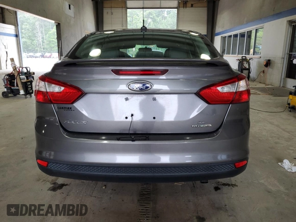 2013 Ford Focus SE with VIN 1FADP3F20DL250081, listed as a Copart auction lot 62140995 with 78,118 mi miles and Salvage title. Bid and sale history available at DreamBid. Image 6.