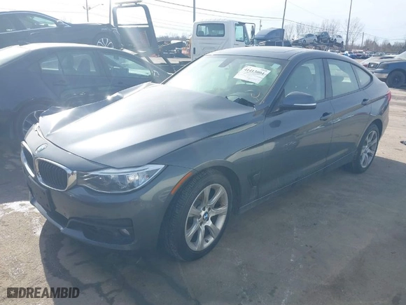 2014 BMW 3 Series Gran Turismo 335i xDrive with VIN WBA3X9C57ED867929, listed as a IAAI auction lot 41413094 with 1 mi miles. Bid and sale history available at carsss.com. Image 2.