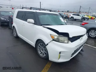 2012 Scion xB with VIN JTLZE4FE5CJ018497, listed as a IAAI auction lot 41805786 with 127,573 mi miles. Bid and sale history available at carsss.com. Image 1.